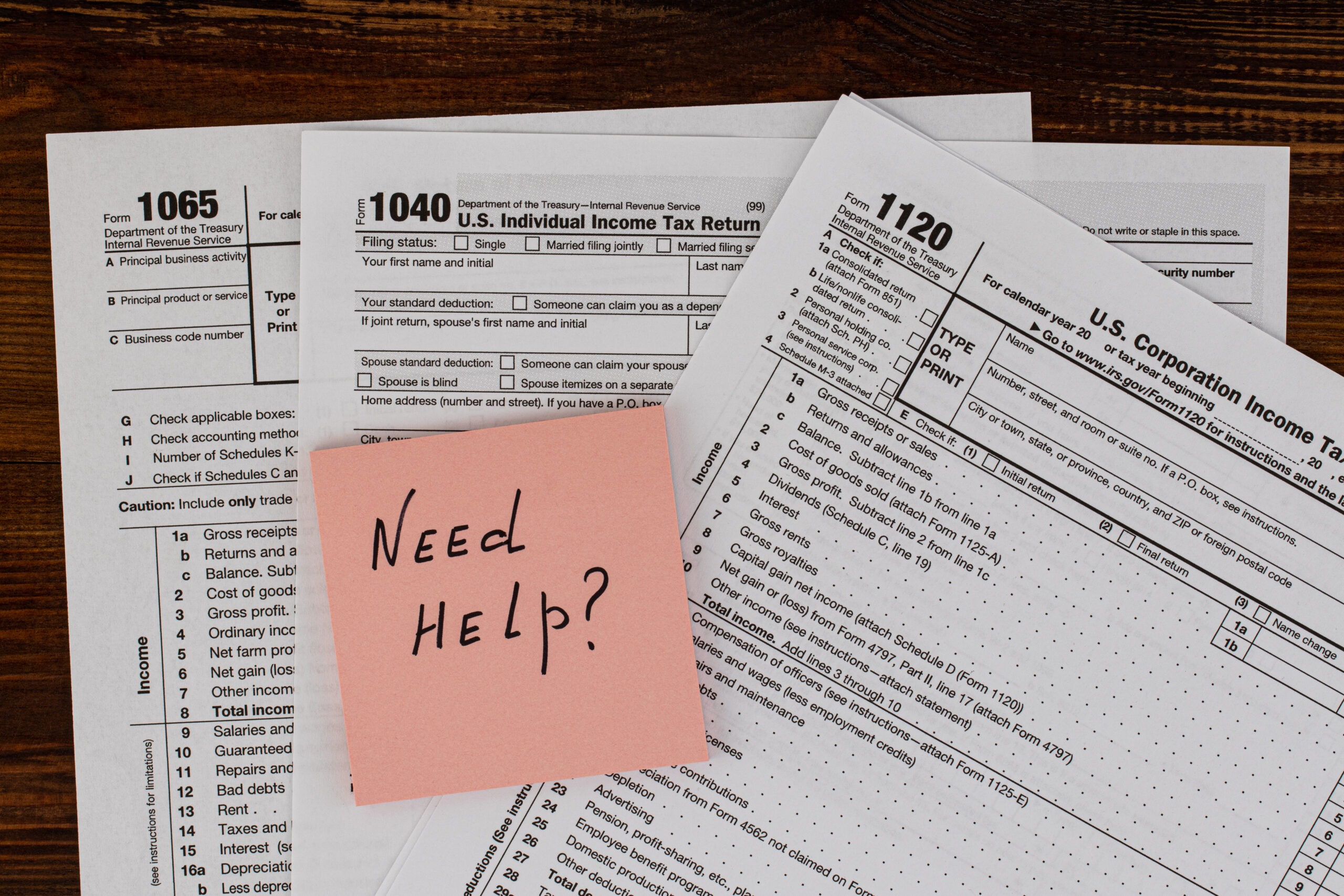 Tax Time written on paper note with tax form